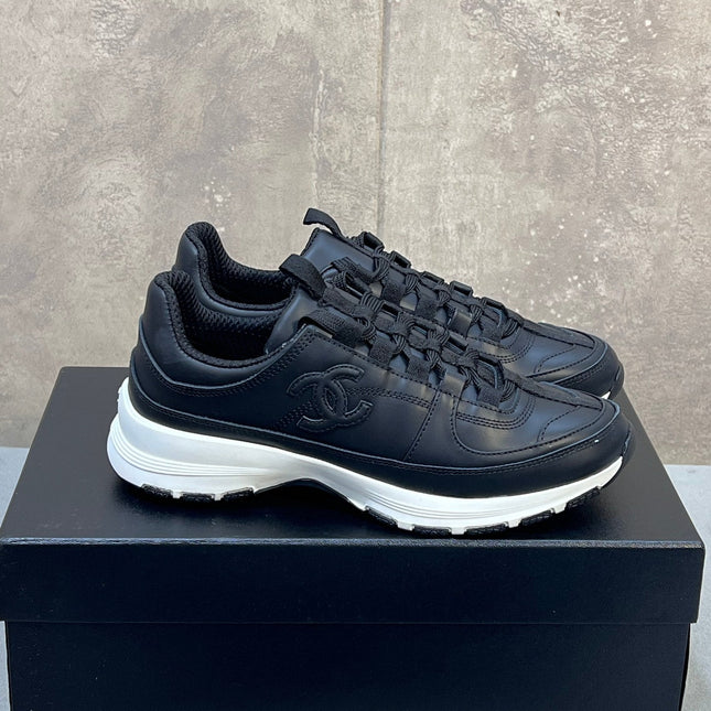 CHANEL 26S RUNNER CC LOGO SNEAKERS IN BLACK CALFSKIN