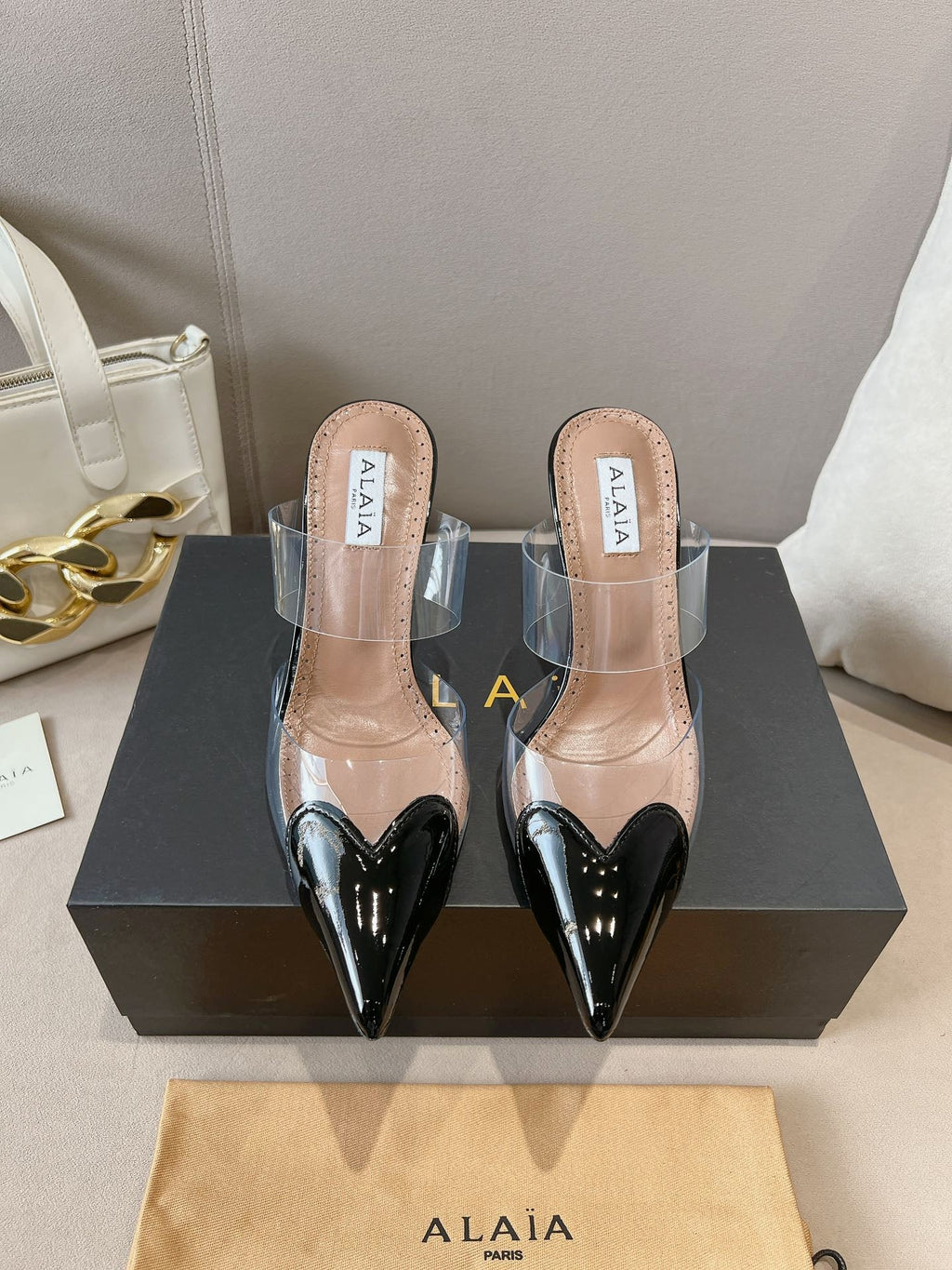 ALAIA HIGH MULES IN BLACK PATENT CALFSKIN AND FILM