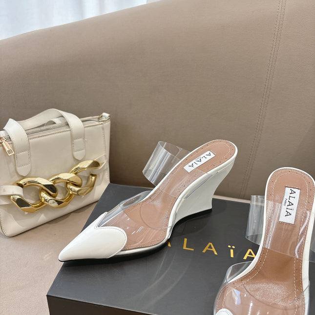 ALAIA 26S HIGH-HEEL WEDGE MULES 95 MM IN WHITE GLOSSY CALFSKIN
