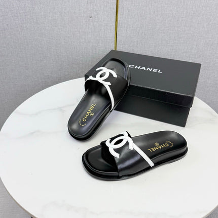 CHANEL 26S ICONIC CC SLIDES IN BLACK LAMBSKIN