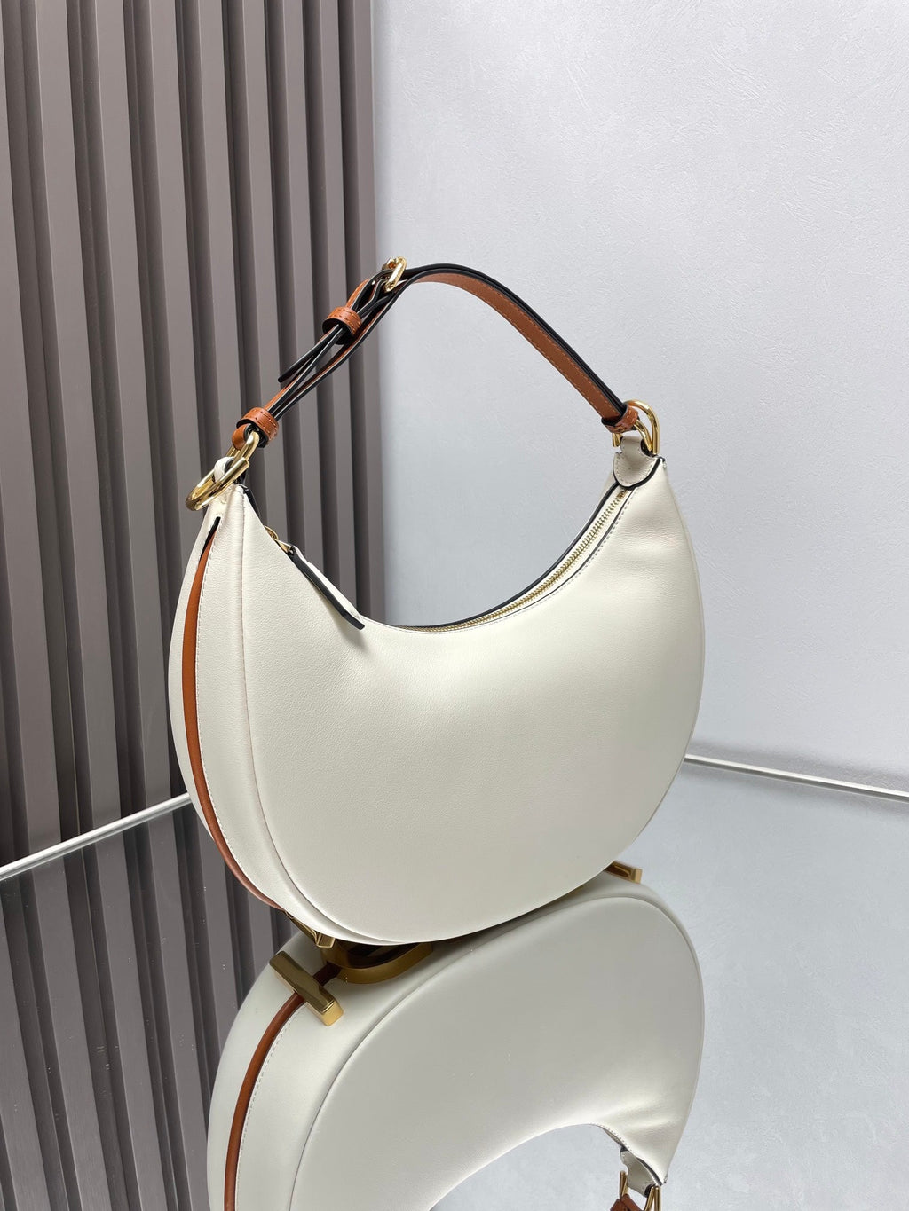 FENDIGRAPHY MEDIUM 29 IN WHITE AND ORANGE TRIM SMOOTH LAMBSKIN GOLD HARDWARE