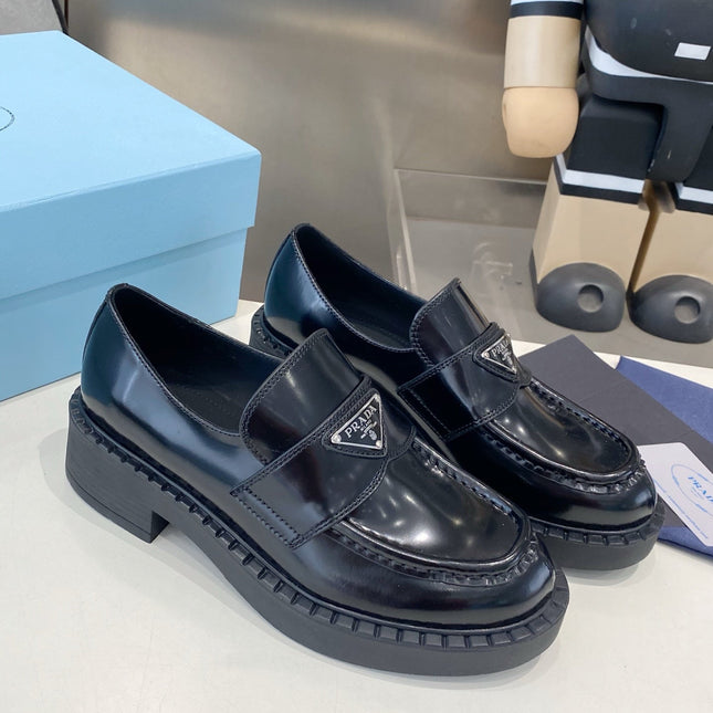 PRADA 26S LOAFERS IN BLACK CALFSKIN WITH LOGO SILVER HARDWARE