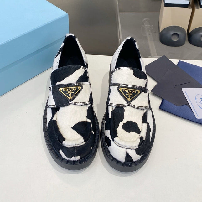 PRADA 26S LOAFERS IN WHITE AND BLACK COW PRINT PONY HAIR