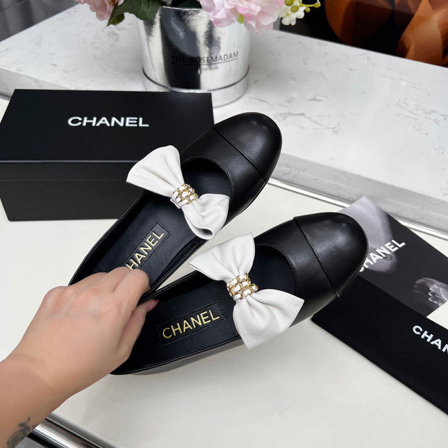 CHANEL 25S MARY JANES IN BLACK CALFSKIN WITH WHITE BOW GOLD HARDWARE