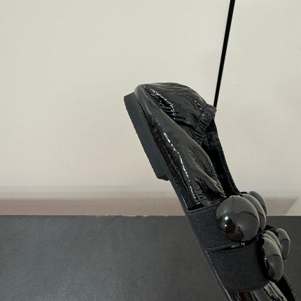 ALAIA SPHERE BALLET FLATS IN BLACK LAMBSKIN