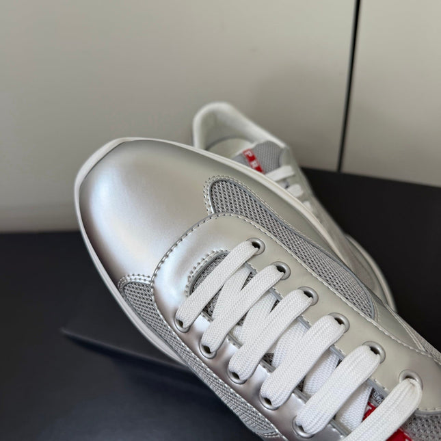 PRADA 26S SNEAKERS IN SILVER CALFSKIN AND WHITE MESH