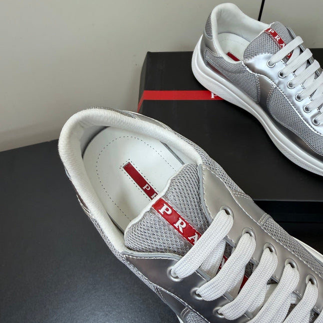 PRADA 26S SNEAKERS IN SILVER CALFSKIN AND WHITE MESH