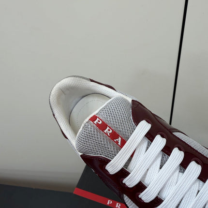 PRADA 26S SNEAKERS IN BURGUNDY RED PATENT CALFSKIN AND WHITE MESH