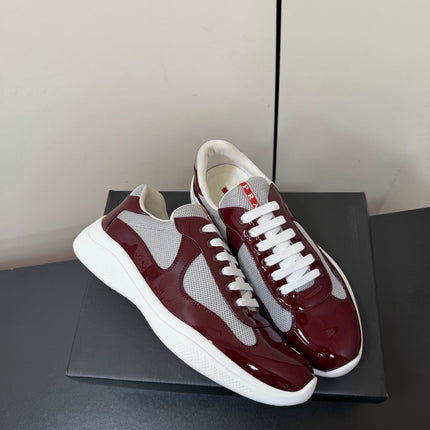 PRADA 26S SNEAKERS IN BURGUNDY RED PATENT CALFSKIN AND WHITE MESH