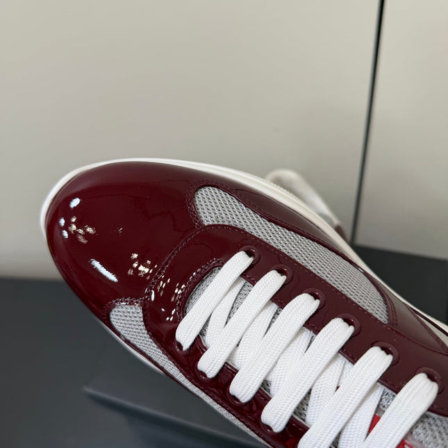 PRADA 26S SNEAKERS IN BURGUNDY RED PATENT CALFSKIN AND WHITE MESH