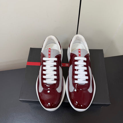 PRADA 26S SNEAKERS IN BURGUNDY RED PATENT CALFSKIN AND WHITE MESH
