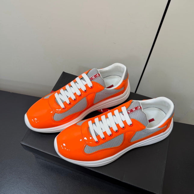 PRADA 26S SNEAKERS IN ORANGE PATENT CALFSKIN AND WHITE MESH