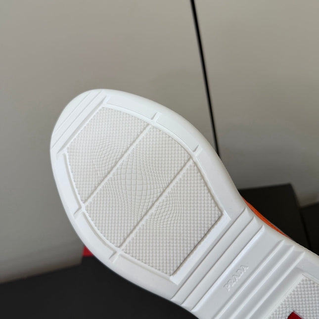 PRADA 26S SNEAKERS IN ORANGE PATENT CALFSKIN AND WHITE MESH