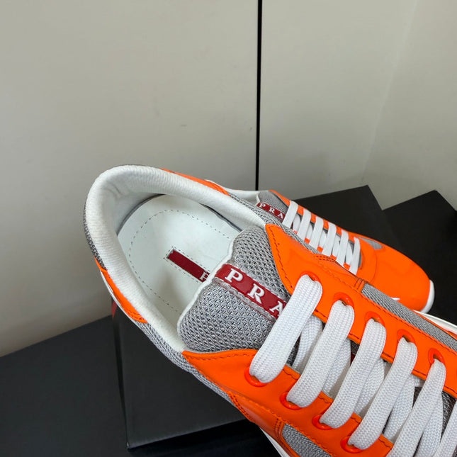PRADA 26S SNEAKERS IN ORANGE PATENT CALFSKIN AND WHITE MESH
