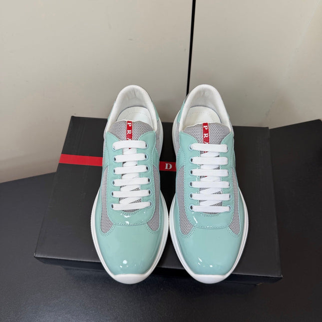 PRADA 26S SNEAKERS IN SOFT TEAL PATENT CALFSKIN AND WHITE MESH