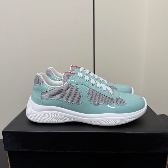 PRADA 26S SNEAKERS IN SOFT TEAL PATENT CALFSKIN AND WHITE MESH