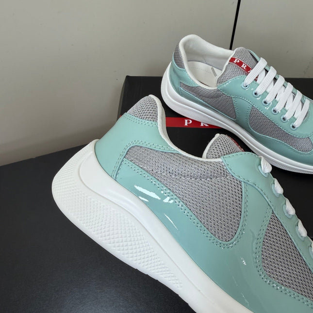 PRADA 26S SNEAKERS IN SOFT TEAL PATENT CALFSKIN AND WHITE MESH