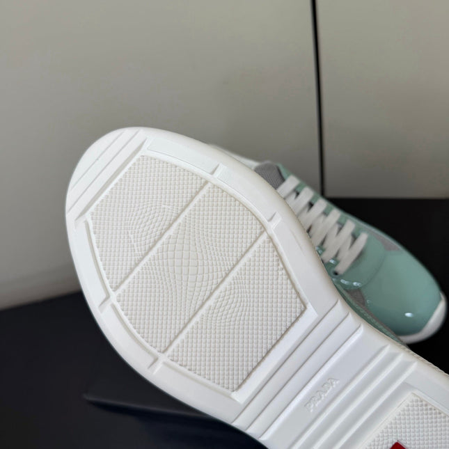 PRADA 26S SNEAKERS IN SOFT TEAL PATENT CALFSKIN AND WHITE MESH