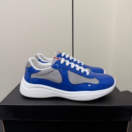 PRADA 26S SNEAKERS IN DARK BLUE PATENT CALFSKIN AND WHITE MESH