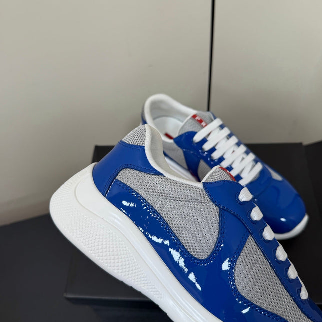 PRADA 26S SNEAKERS IN DARK BLUE PATENT CALFSKIN AND WHITE MESH