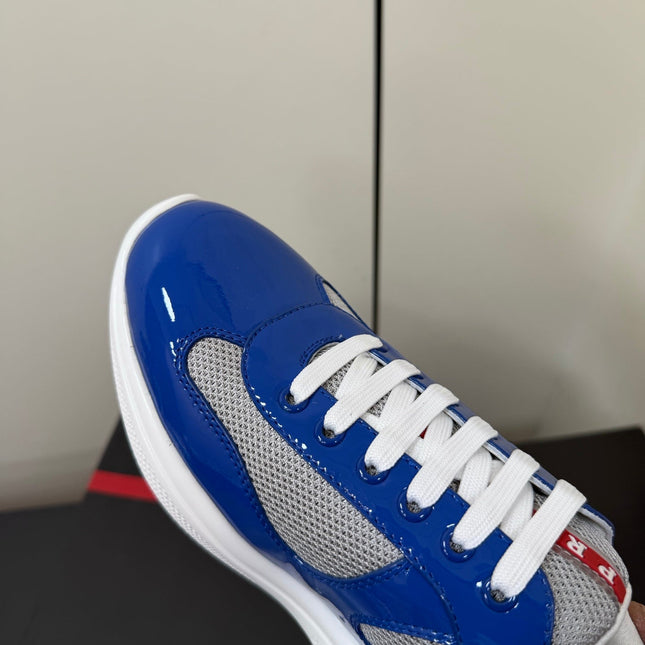 PRADA 26S SNEAKERS IN DARK BLUE PATENT CALFSKIN AND WHITE MESH