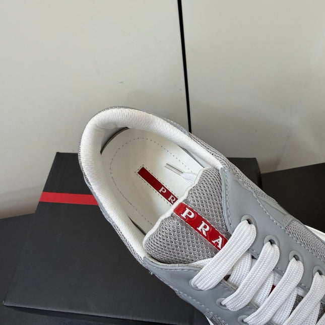 PRADA 26S SNEAKERS IN LIGHT GRAY PATENT CALFSKIN AND WHITE MESH
