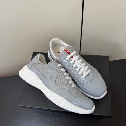 PRADA 26S SNEAKERS IN LIGHT GRAY PATENT CALFSKIN AND WHITE MESH