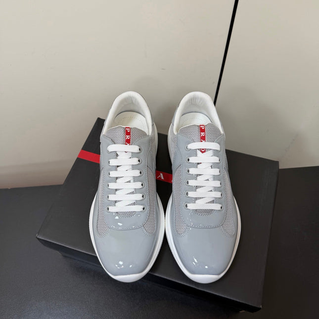 PRADA 26S SNEAKERS IN LIGHT GRAY PATENT CALFSKIN AND WHITE MESH