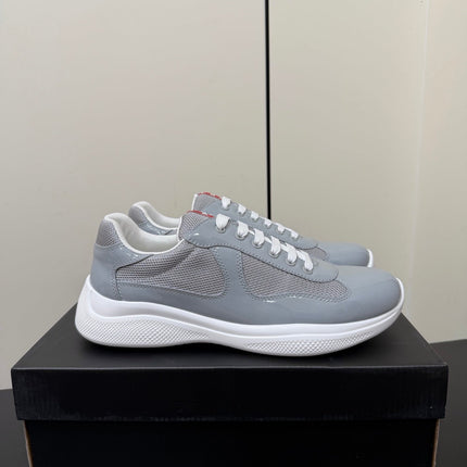 PRADA 26S SNEAKERS IN LIGHT GRAY PATENT CALFSKIN AND WHITE MESH
