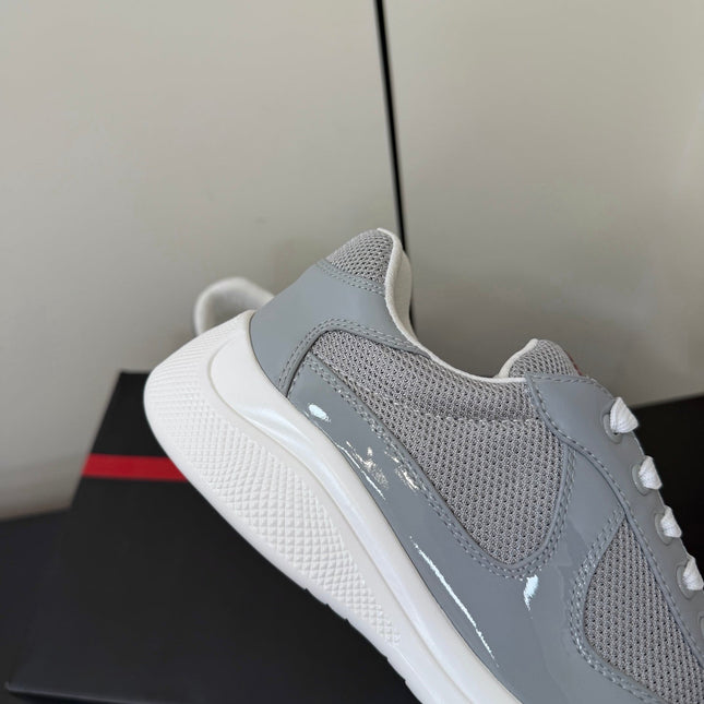 PRADA 26S SNEAKERS IN LIGHT GRAY PATENT CALFSKIN AND WHITE MESH