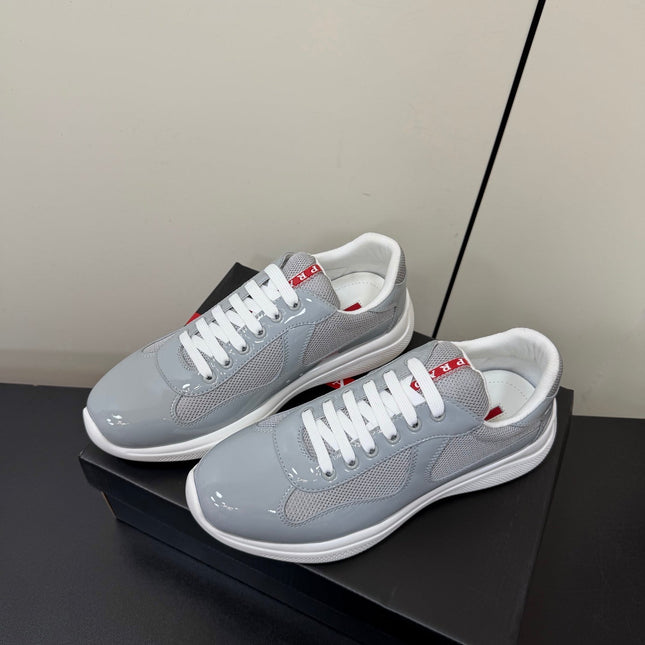 PRADA 26S SNEAKERS IN LIGHT GRAY PATENT CALFSKIN AND WHITE MESH