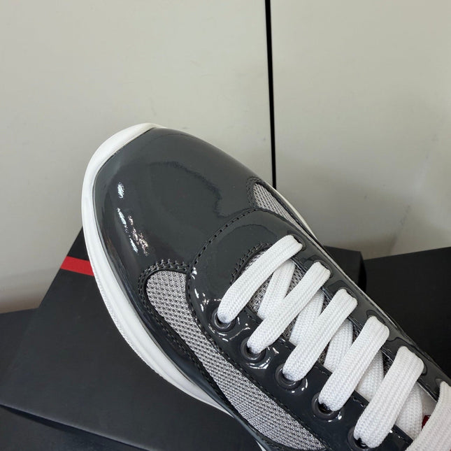 PRADA 26S SNEAKERS IN GRAY PATENT CALFSKIN AND WHITE MESH