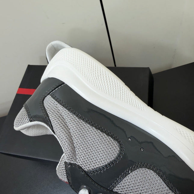 PRADA 26S SNEAKERS IN GRAY PATENT CALFSKIN AND WHITE MESH