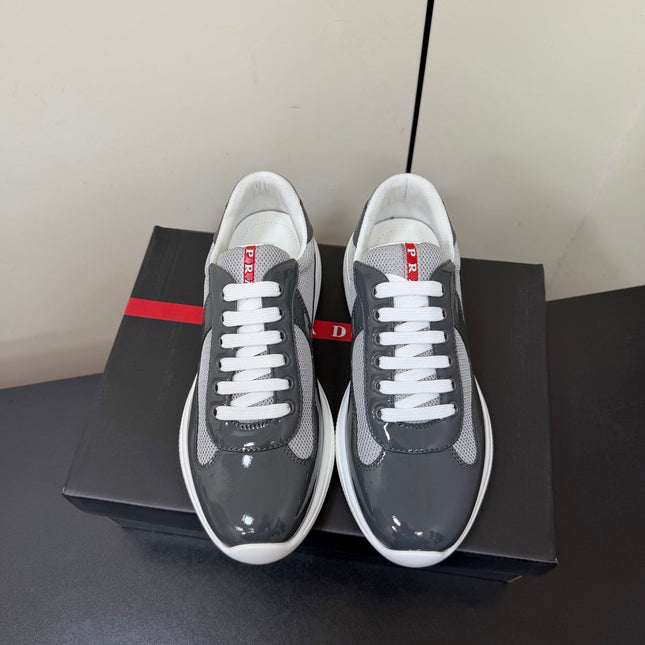 PRADA 26S SNEAKERS IN GRAY PATENT CALFSKIN AND WHITE MESH