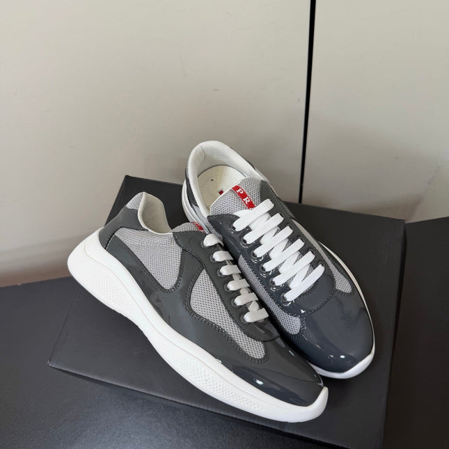 PRADA 26S SNEAKERS IN GRAY PATENT CALFSKIN AND WHITE MESH