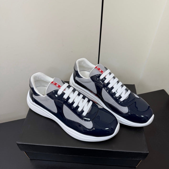 PRADA 26S SNEAKERS IN NAVY BLUE PATENT CALFSKIN AND WHITE MESH