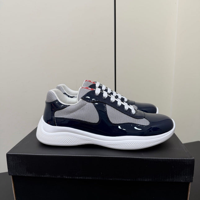 PRADA 26S SNEAKERS IN NAVY BLUE PATENT CALFSKIN AND WHITE MESH