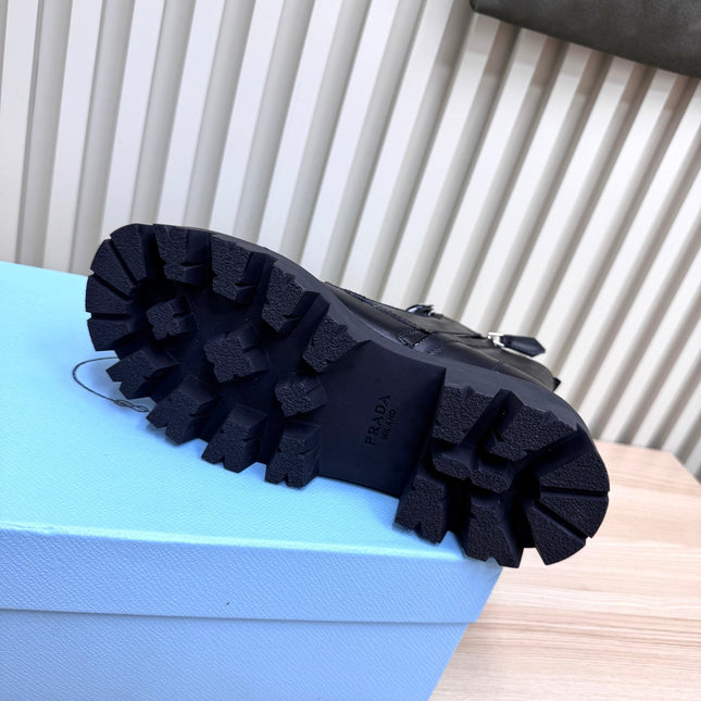 PRADA 25S MONOLITH BOOTS IN BLACK CALFSKIN