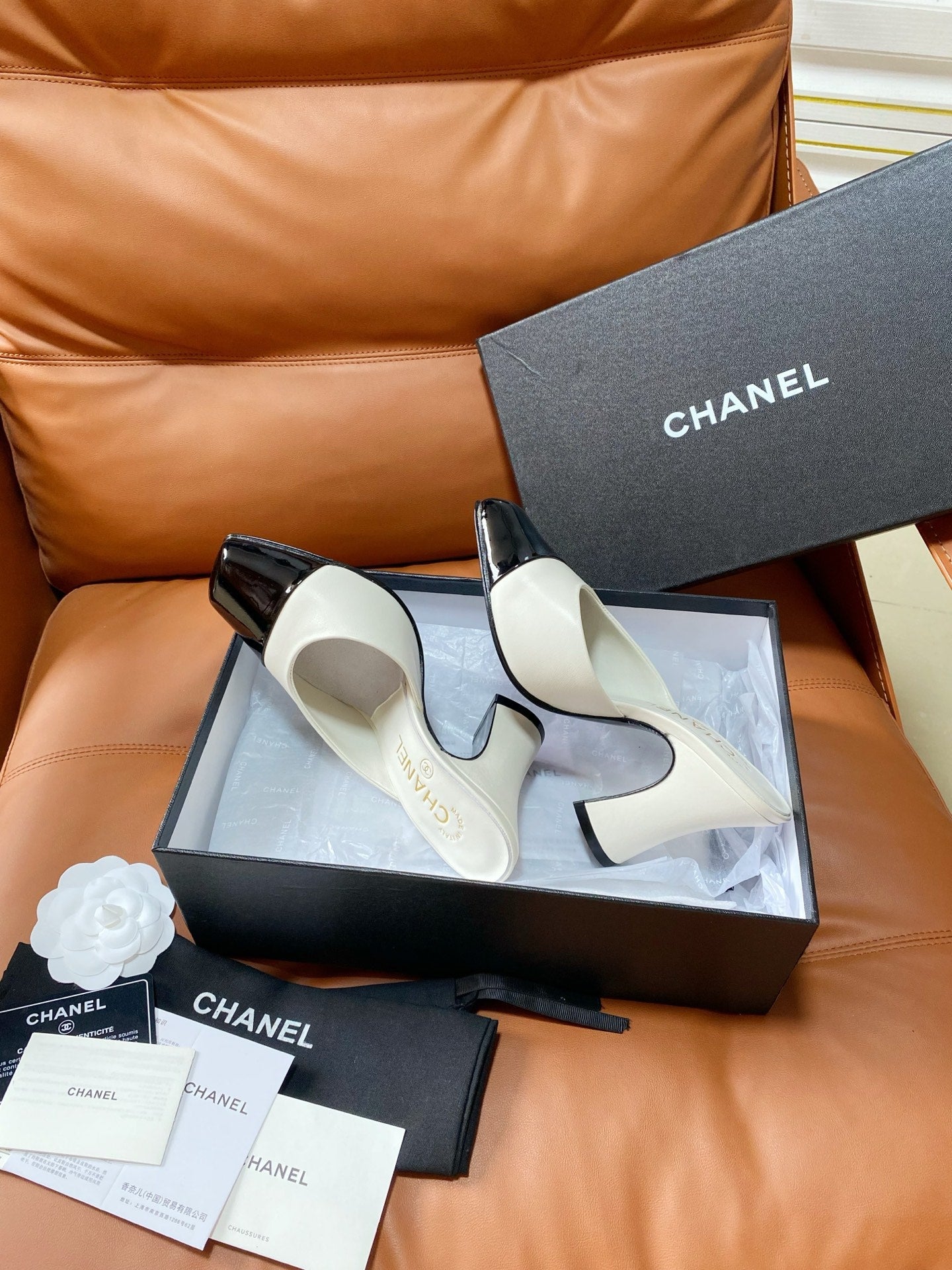 CHANEL 26S HIGH-HEEL MULES 90 MM IN BLACK AND WHITE LAMBSKIN