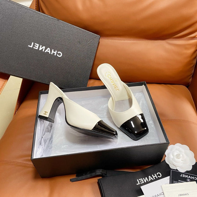 CHANEL 26S HIGH-HEEL MULES 90 MM IN BLACK AND WHITE LAMBSKIN