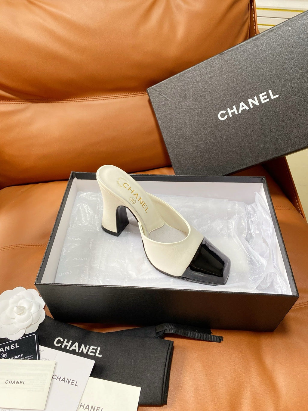 CHANEL 26S HIGH-HEEL MULES 90 MM IN BLACK AND WHITE LAMBSKIN