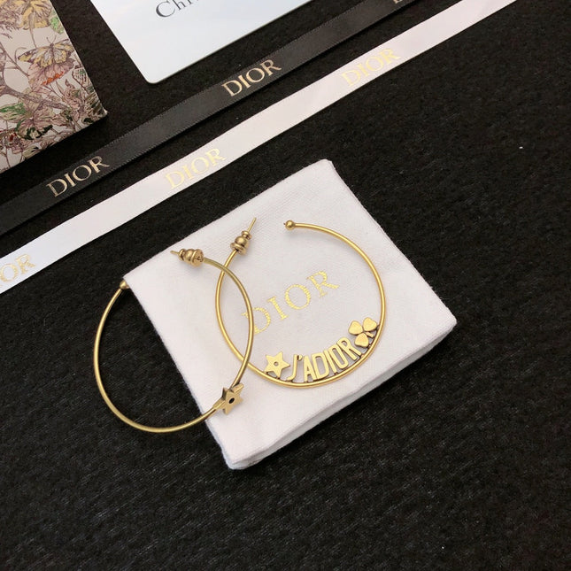 CD 26S STAR HOOP EARRINGS IN GOLD TONE METAL 644456
