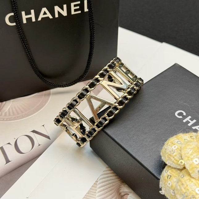 CHANEL 26S CHANEL LOGO OPEN CUFF LEATHER CHAIN BRACELET IN GOLD METAL 630836