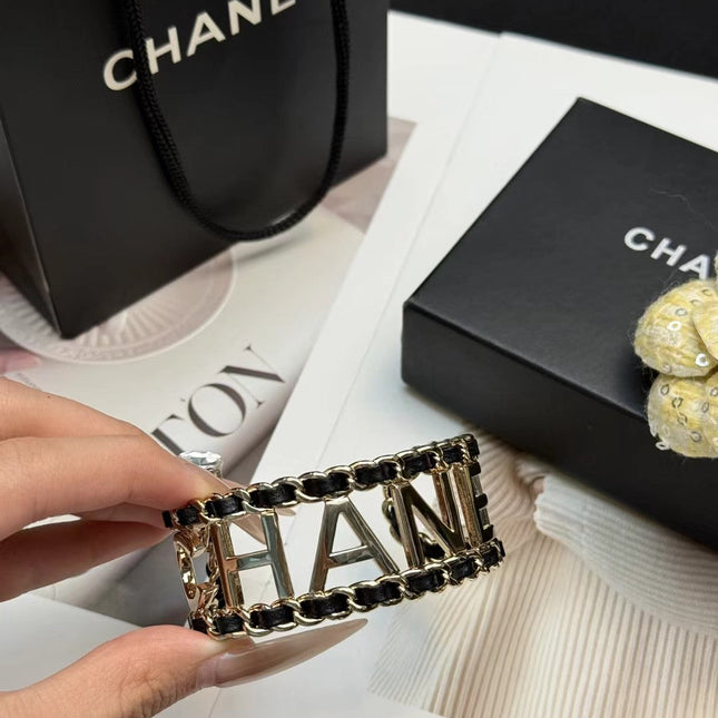 CHANEL 26S CHANEL LOGO OPEN CUFF LEATHER CHAIN BRACELET IN GOLD METAL 630836
