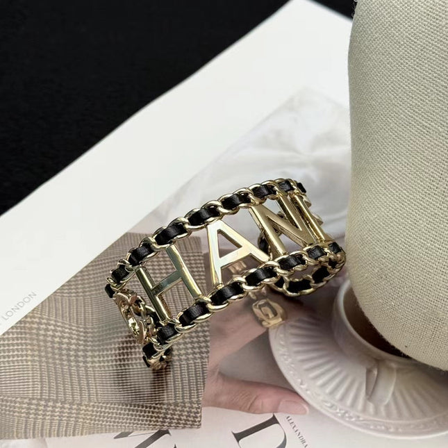 CHANEL 26S CHANEL LOGO OPEN CUFF LEATHER CHAIN BRACELET IN GOLD METAL 630836