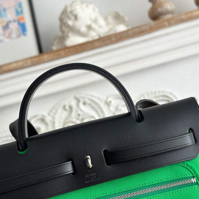 ZIP CABINE 31 BAG IN EMERALD GREEN CANVAS AND BLACK CALFSKIN