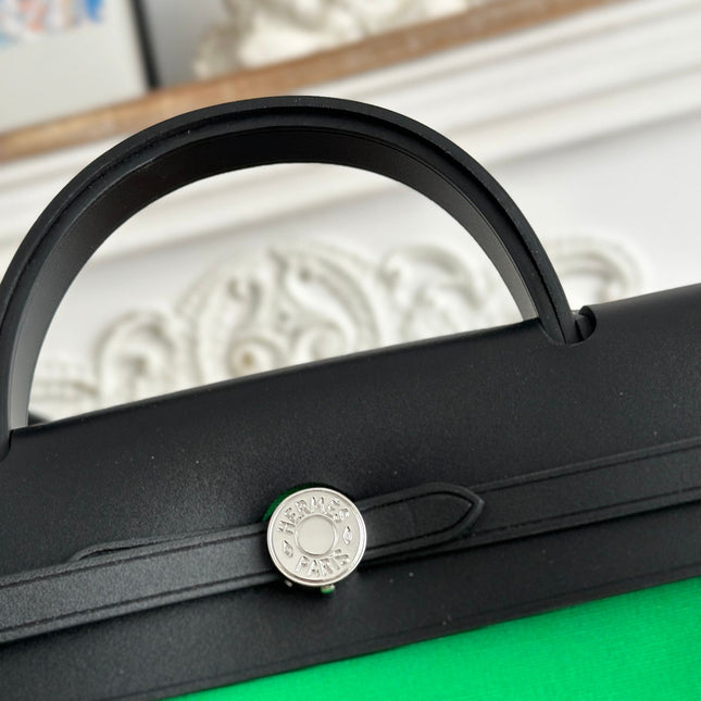 ZIP CABINE 31 BAG IN EMERALD GREEN CANVAS AND BLACK CALFSKIN