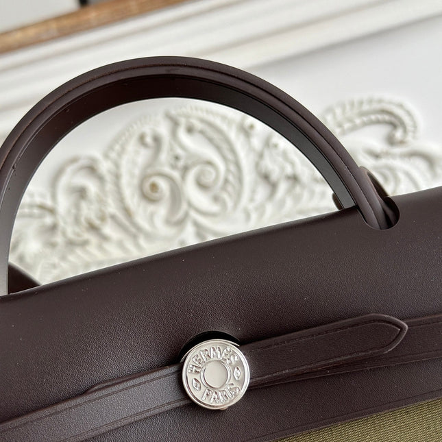 ZIP CABINE 31 BAG IN OLIVE GREEN CANVAS AND BLACK CALFSKIN
