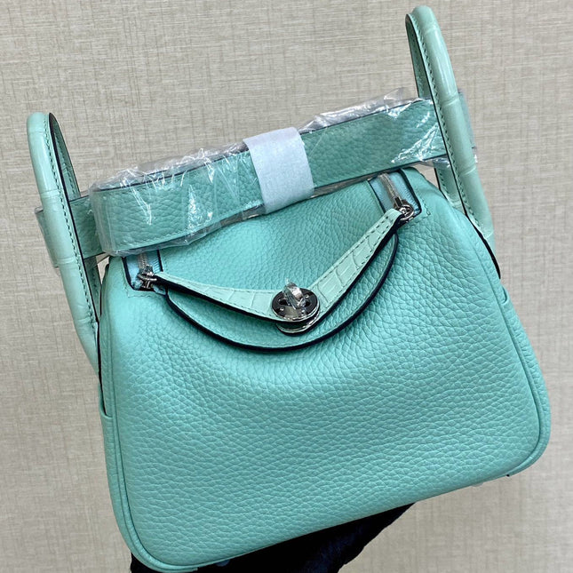 HM 25S MINI LINDY 19 CM IN AQUAMARINE COWHIDE WITH CROCODILE HANDLE AND SILVER HARDWARE
