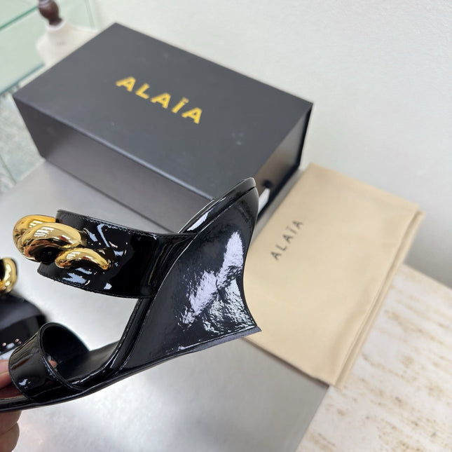 ALAIA 26S DOUBLE STRAP WEDGE SANDALS 110 MM IN BLACK GLOSSY CALFSKIN WITH GOLD HARDWARE